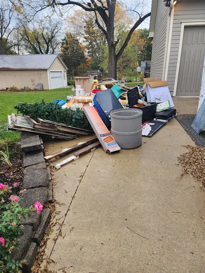Dumpster being loaded with debris for Roofing Dumpster Rental in Berne